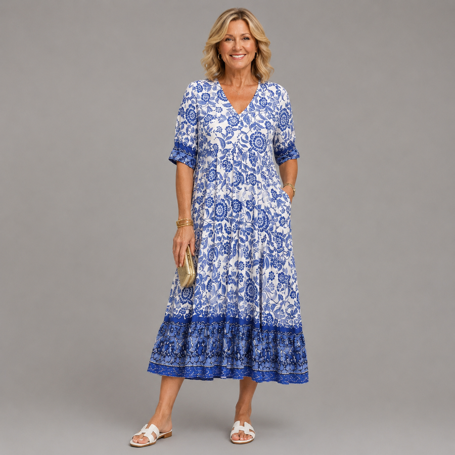 Blue floral V-neck midi dress with short sleeves and tiered skirt