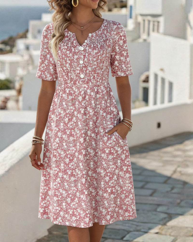 Abito midi floreale rosa con scollo a V e bottoni frontali, maniche a 3/4