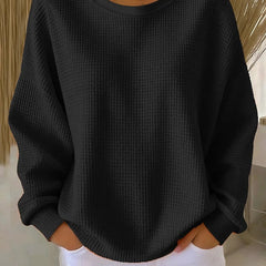 NYLA classic sweater in black waffle-knit, crewneck, long sleeves with ribbed cuffs.