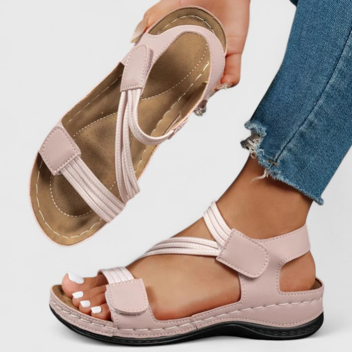 Sandali ortopedici leggeri rosa con cinturini regolabili e fascia elastica, suola sagomata