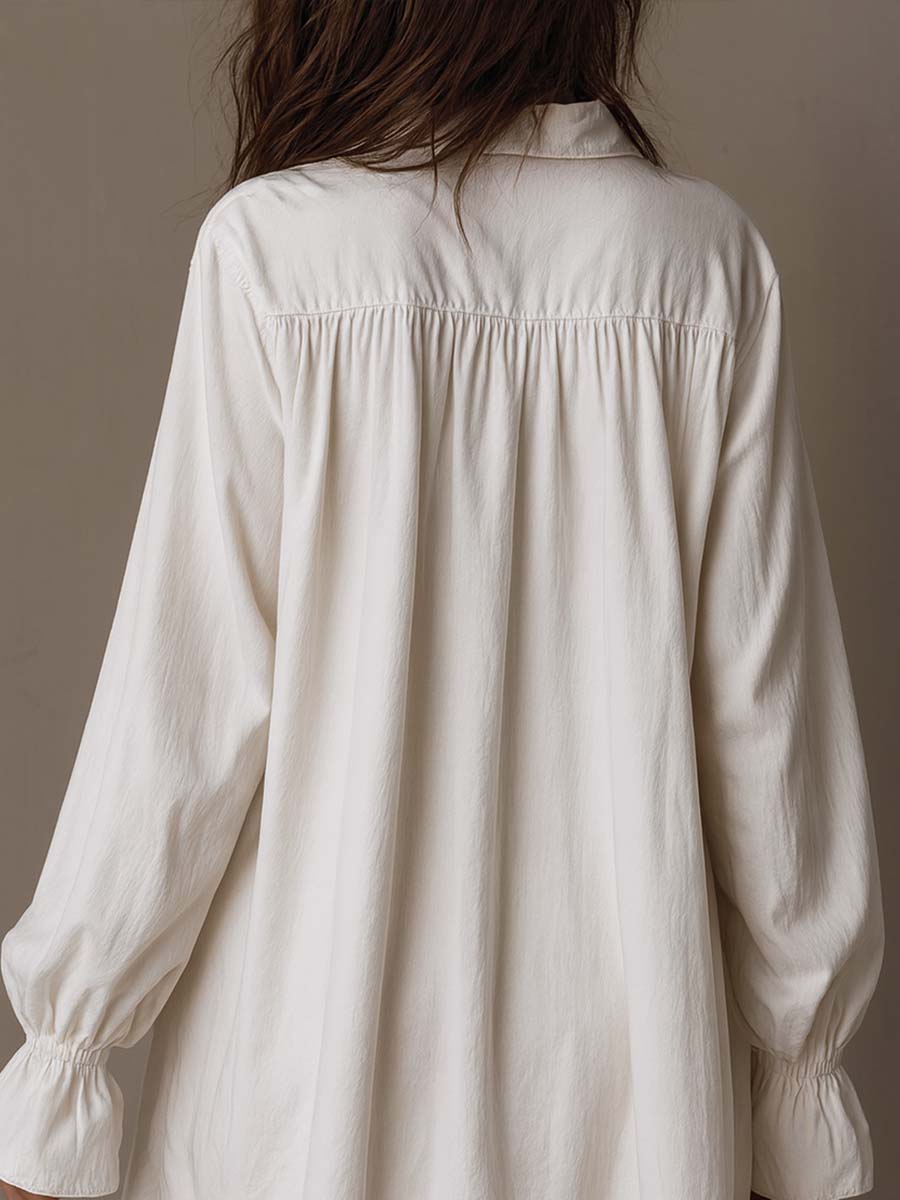 White mini shirt dress back with gathered yoke and long balloon sleeves
