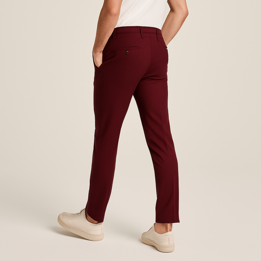 Slim-fit tailored trousers in dark red with belt loops and button closure.