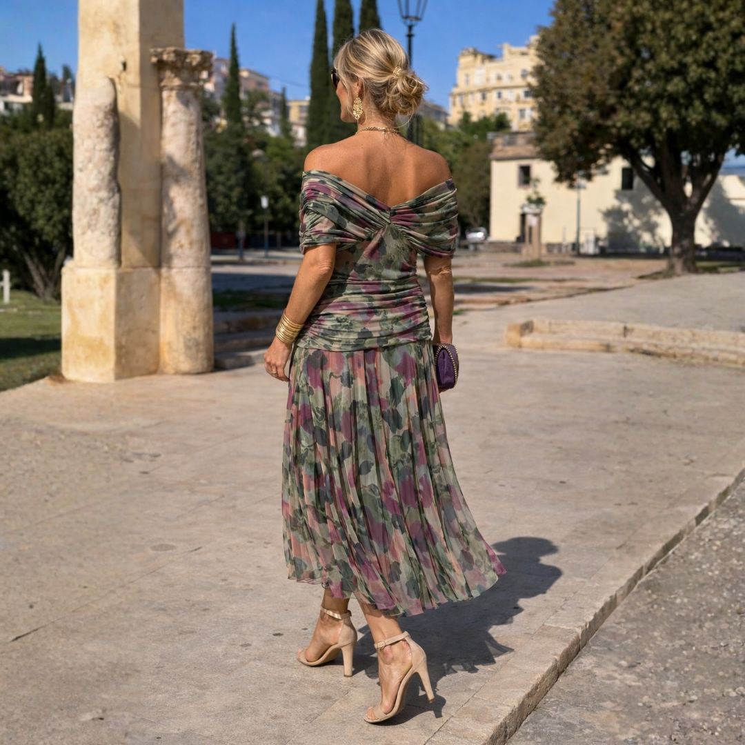 Abito lungo a spalle scoperte a fiori multicolore con scollo incrociato e gonna fluida