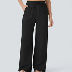 Black wide-leg trousers with elastic waistband and drawstring ties