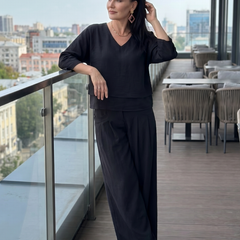 Black V-neck layered top with wide-leg pants set, elbow-length sleeves