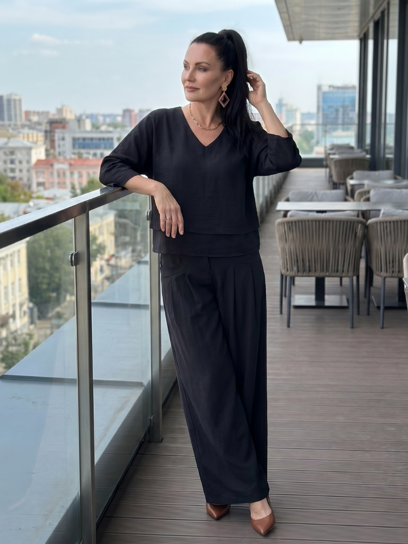 Black V-neck layered top with wide-leg pants set, elbow-length sleeves