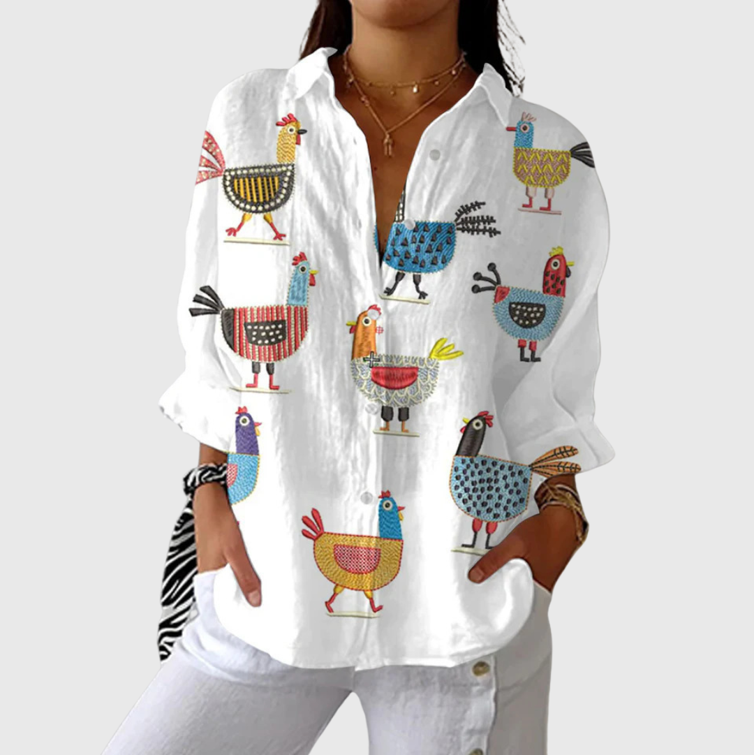 Blusa leggera bianca con stampa multicolore di animali, maniche lunghe e bottoni