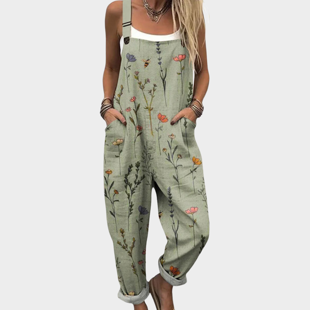 Green printed overalls with floral and insect pattern, sleeveless bib front and wide legs