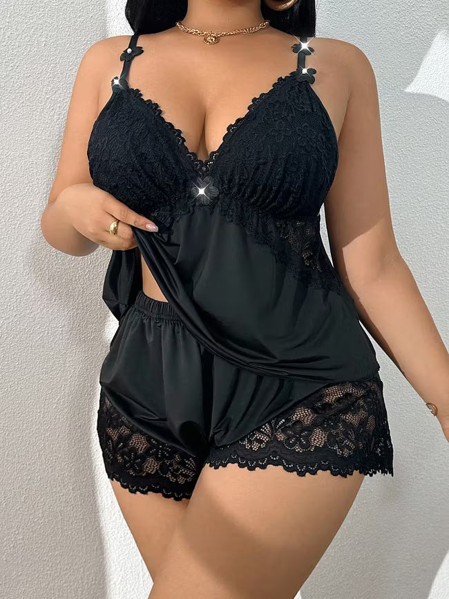 Black lace-trim cami pajama set with lace triangle cups and ruffled shorts