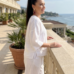 White layered V-neck top and wide-leg pants set with 3/4 sleeves