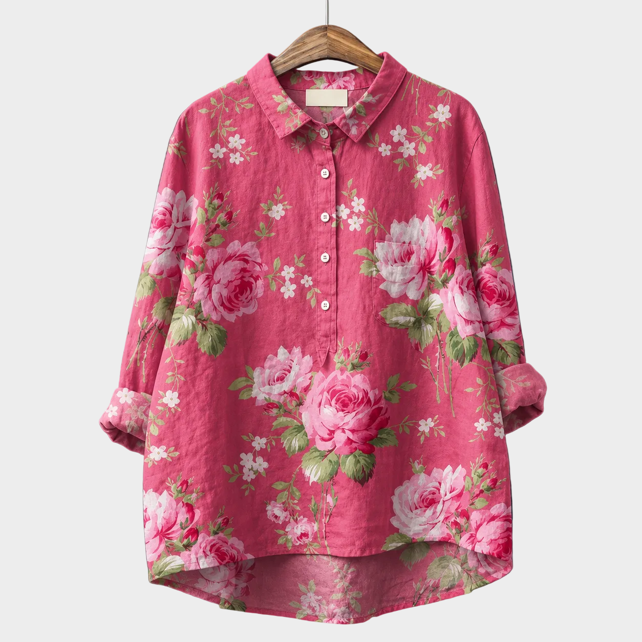 Blusa estiva rosa con stampa floreale, maniche lunghe, bottoni e colletto
