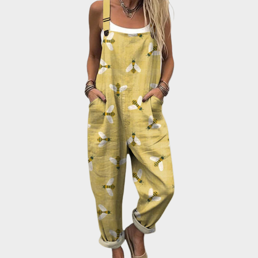 Yellow printed overalls with adjustable straps, bib front pocket and rolled cuffs