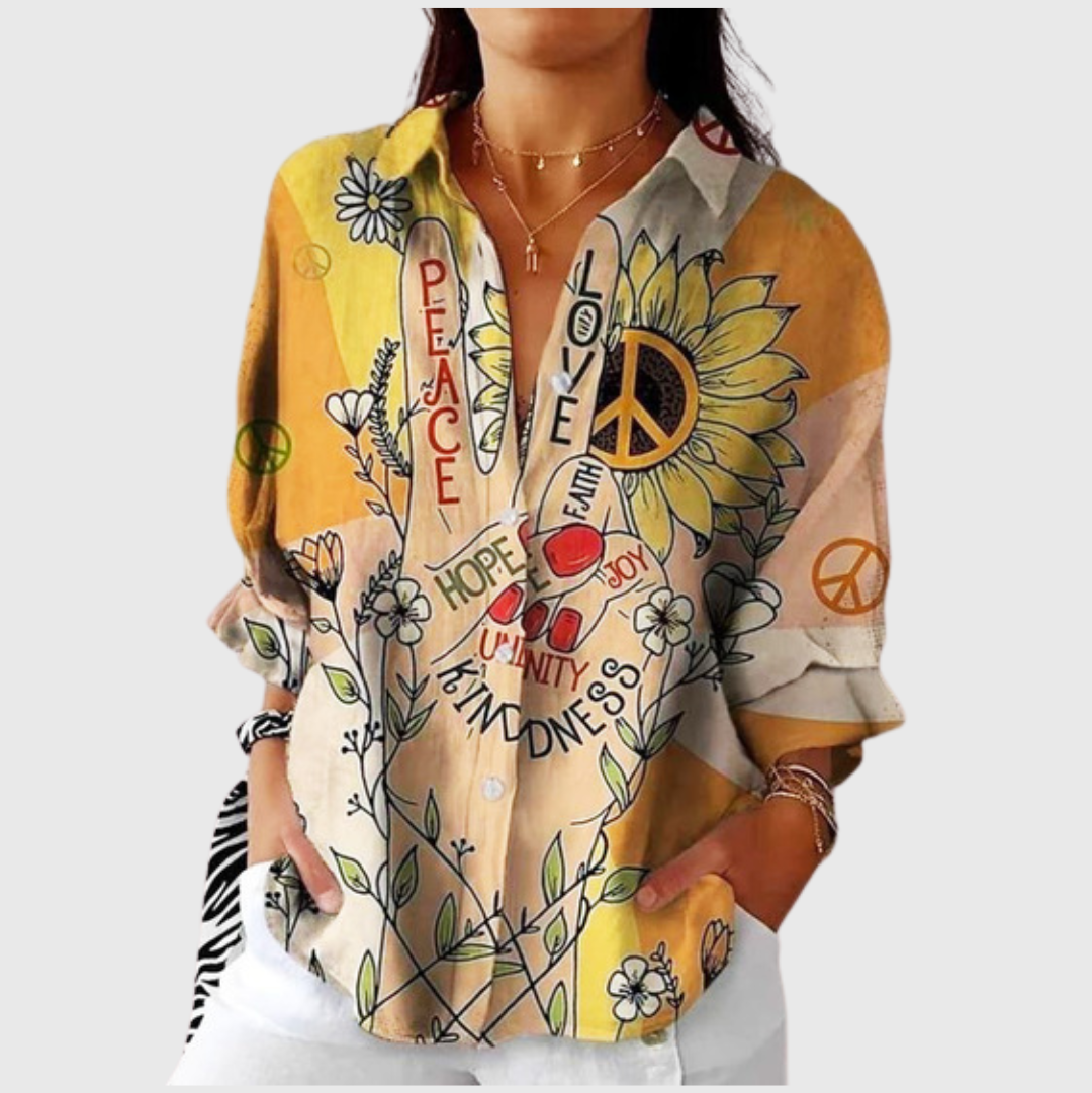 Blusa leggera gialla con stampa floreale e simboli peace, scollo a bottoni
