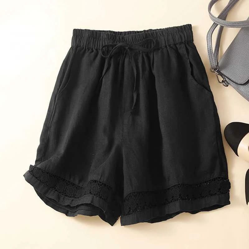 Black linen shorts with elastic waist, drawstring tie, and lace-trim hem.