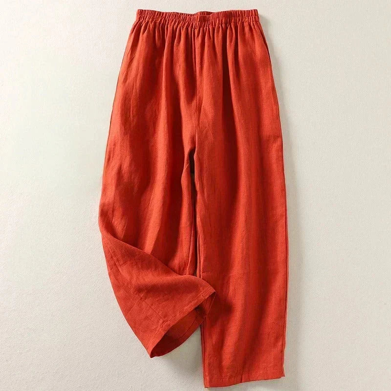 Rust orange lightweight trousers with elastic waistband and relaxed straight leg