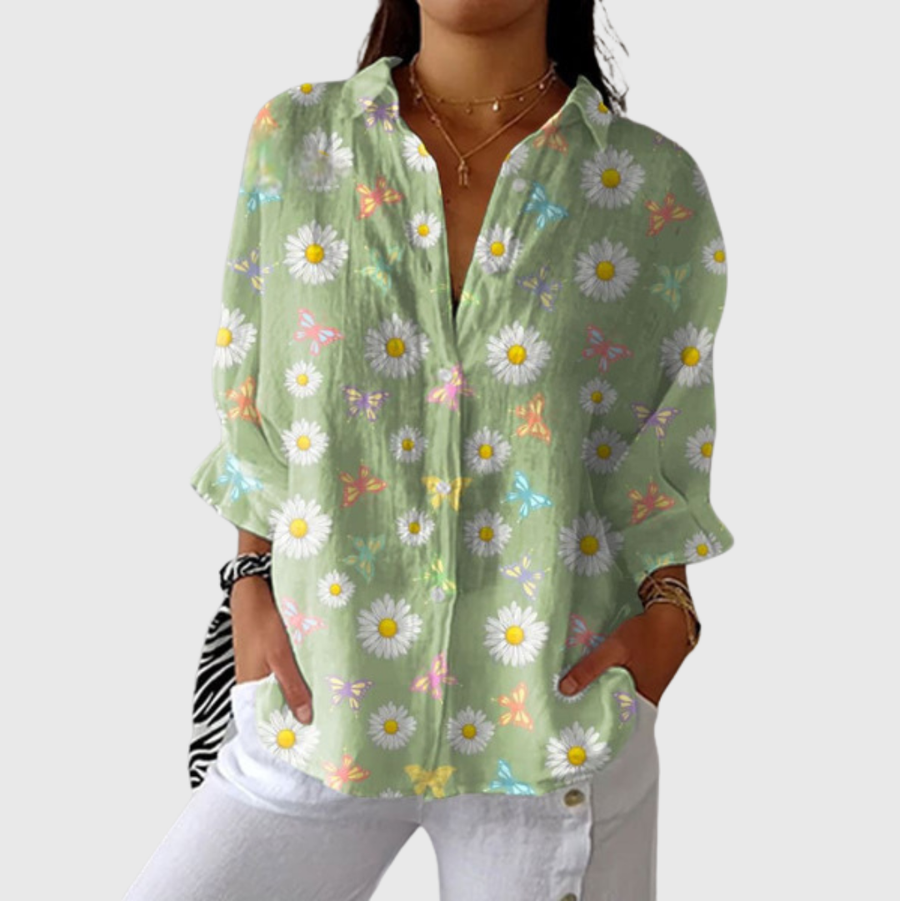 Blusa leggera verde chiaro con stampa floreale a margherite e maniche a camicia