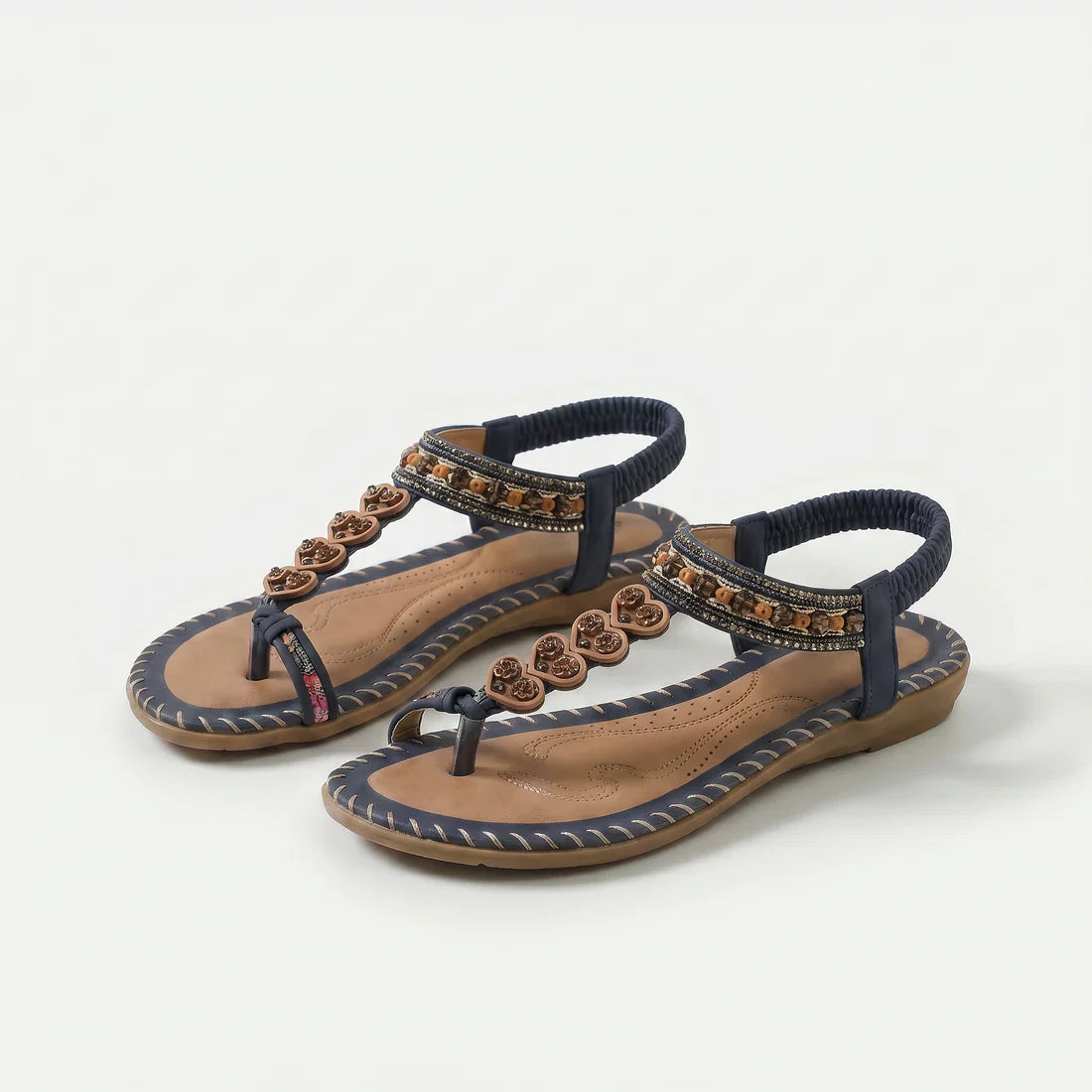 Sandali ortopedici con cinturini blu scuro e bordi decorativi, dettagli marroni sul davanti