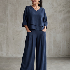 Navy layered V-neck top with wide-leg pants set, full-length front view