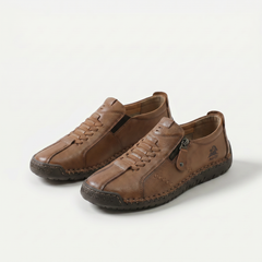 Scarpe comfort ergonomiche marroni con lacci e zip laterale, suola ammortizzata.