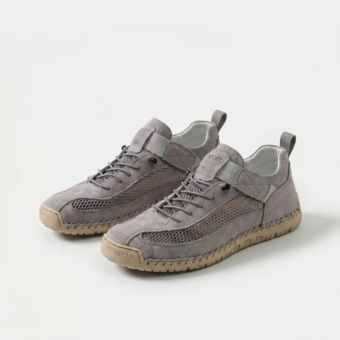 Scarpe ortopediche traspiranti grigie chiare con lacci e cinturino, suola beige.