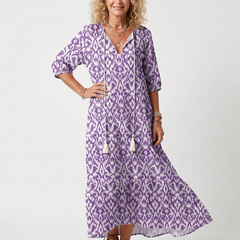 Purple printed midi dress with V-neck, tassel tie, and three-quarter puff sleeves