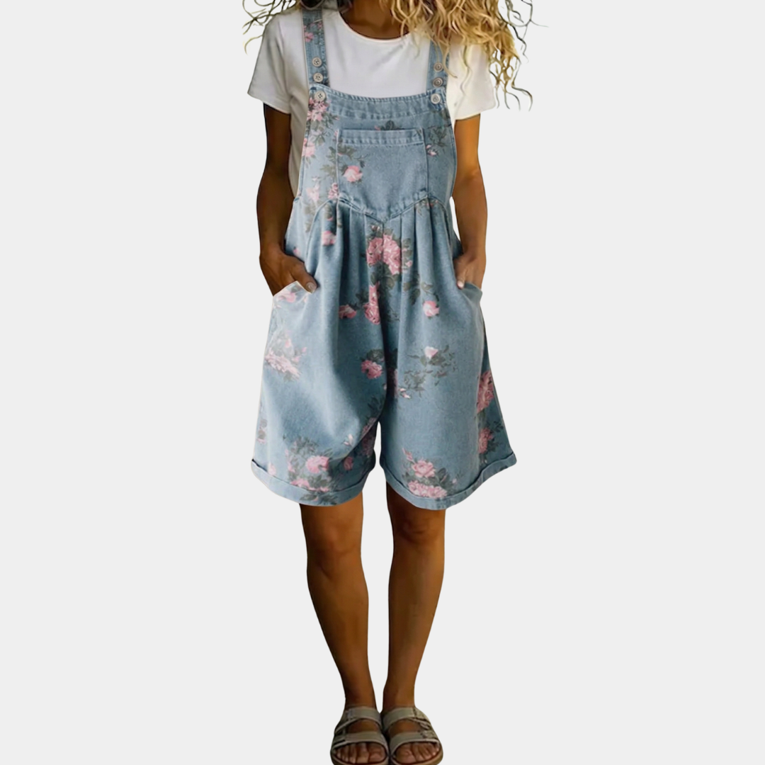 Floral blue denim overall romper with pink rose print, adjustable straps, wide shorts