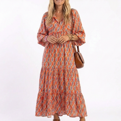 Geometric print V-neck tiered midi dress in orange with blue pattern, 3/4 sleeves