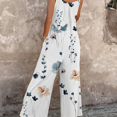 White sleeveless floral overalls with wide-leg cut and blue-green flower print