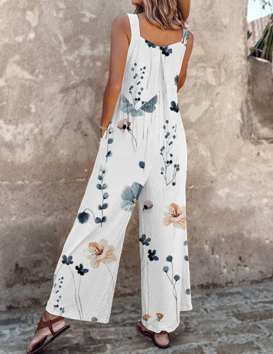 White sleeveless floral overalls with wide-leg cut and blue-green flower print