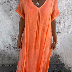 Abito arancione a V con maniche corte e gonna svasata