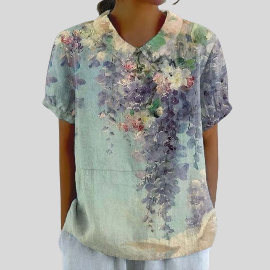 Top floreale a maniche corte con scollo a V, fiori multicolore su verde pastello
