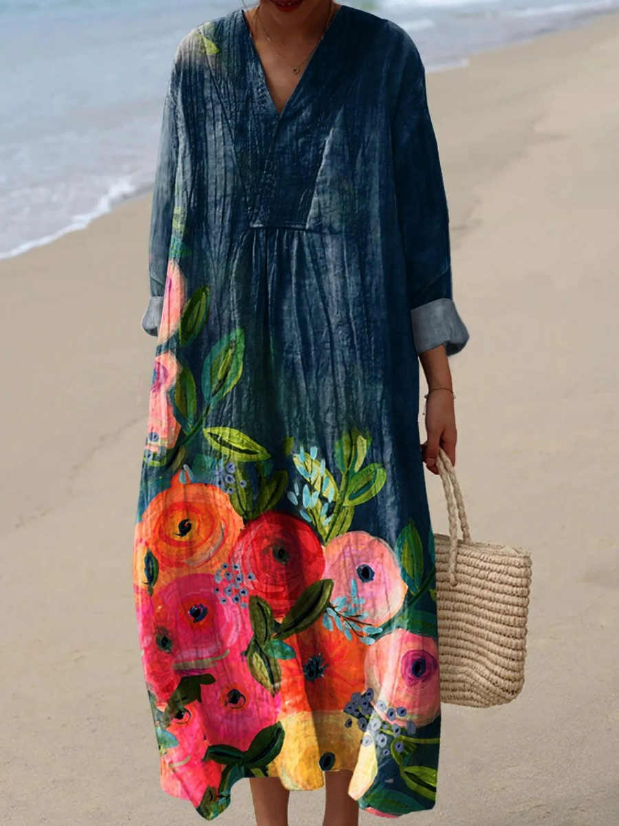 Boho maxi dress in dark teal with long sleeves, V-neck, and vibrant floral print