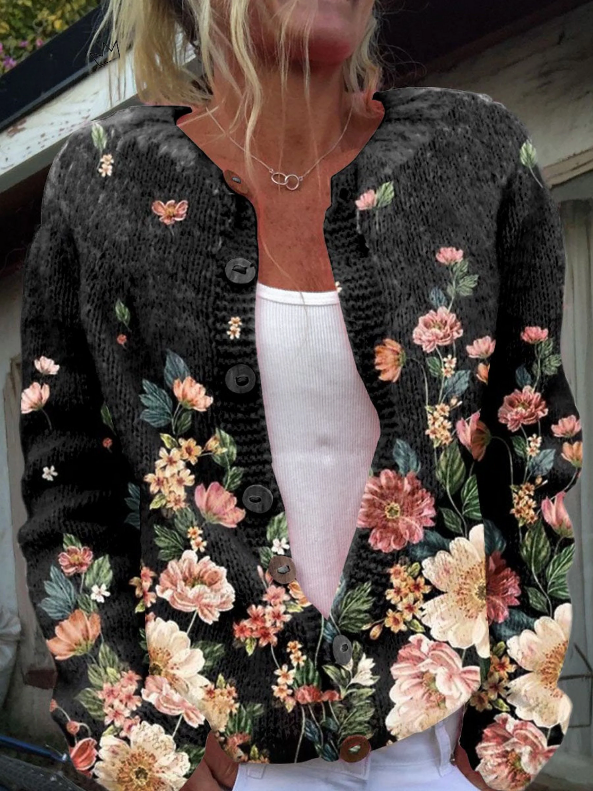 Black knit cardigan with vintage floral print, button-front and scalloped edges