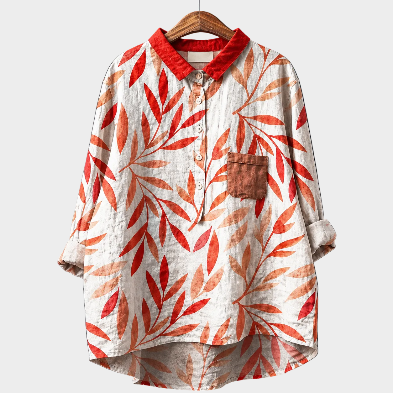 Blusa estiva bianca con stampa foglie rosse, colletto e bottoni, maniche corte