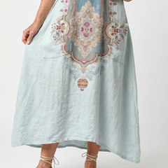 Sky blue pocket midi dress with ornate front embroidery and side pockets, front view