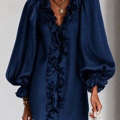 Navy ruffle-sleeve mini dress with layered neckline ruffles and puff sleeves