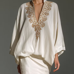 White V-neck two-piece set with gold embroidered neckline and mini skirt