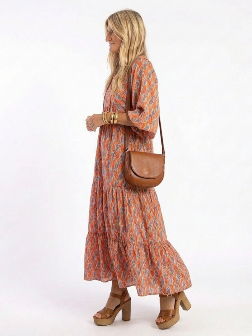 Geometric print V-neck tiered midi dress, orange with blue geometric pattern, side view