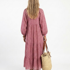 Back view geometric print dusty rose long-sleeve midi dress with billowy sleeves