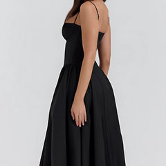 Abito corsetto nero con spalline sottili e gonna svasata a pieghe