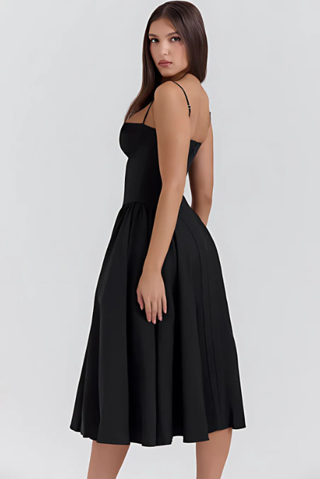 Abito corsetto nero con spalline sottili e gonna svasata a pieghe