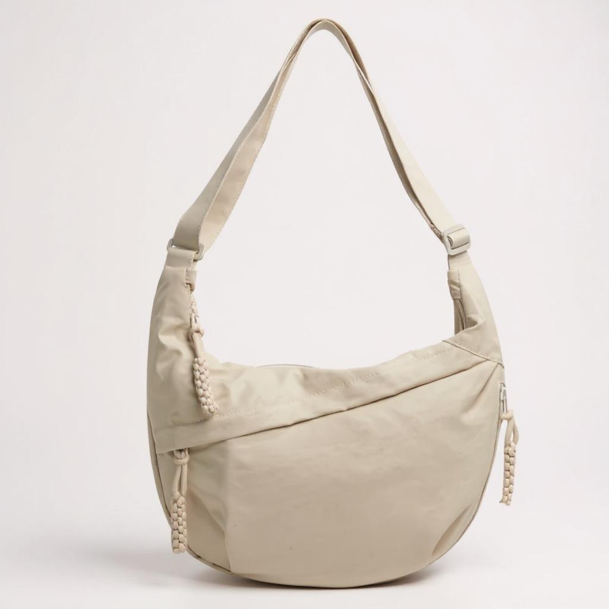 Borsa a tracolla beige in tessuto con zip laterale e tracolla regolabile