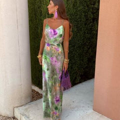 Green floral slip maxi dress with open back, spaghetti straps, floor-length drape