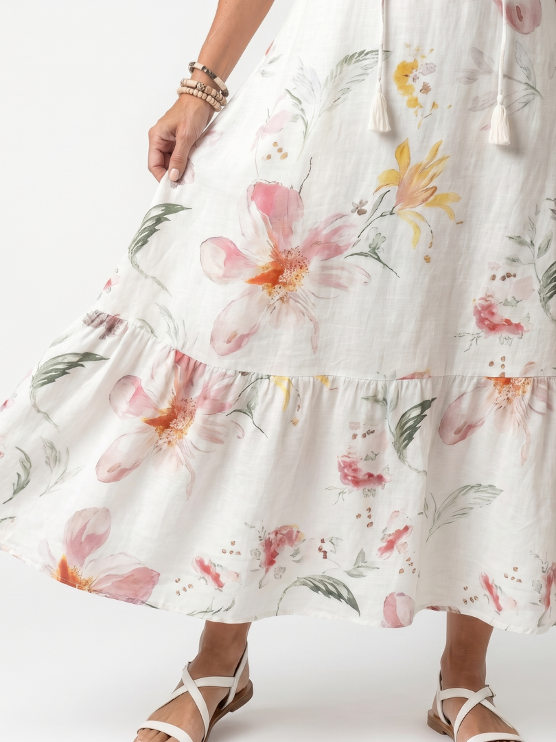 Tiered white midi skirt with large floral print and ruffled hem