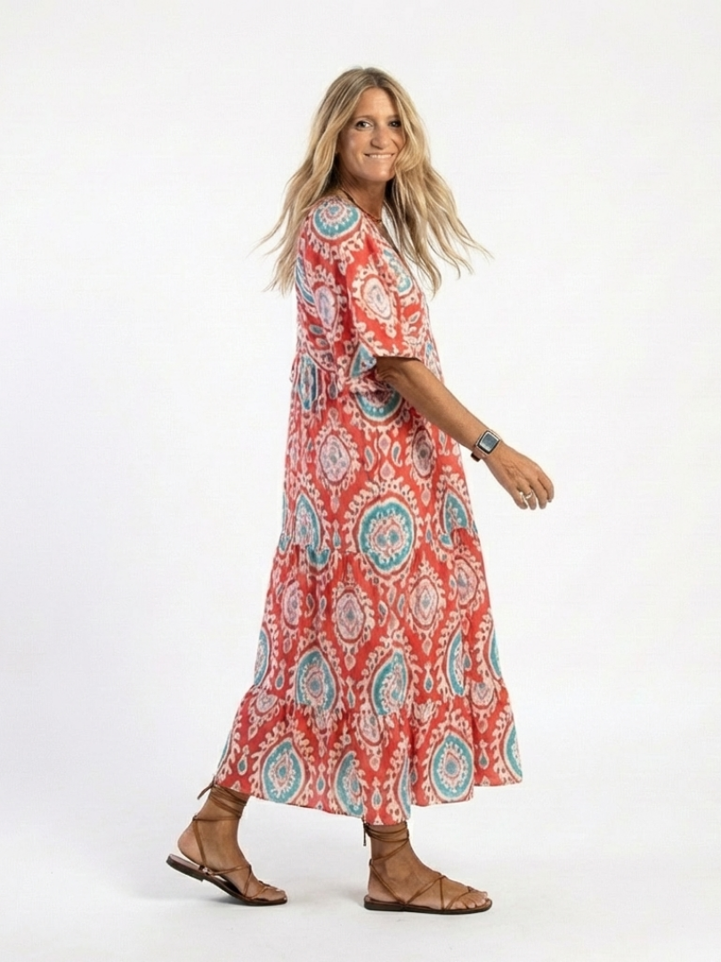Paisley print V-neck midi dress, red with teal circular motifs, side view
