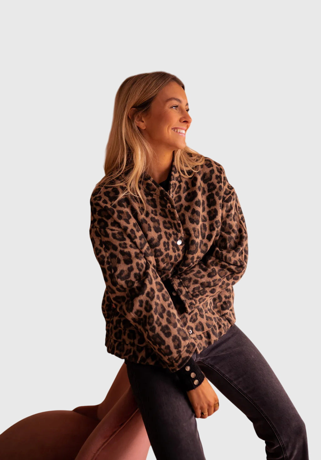Leopard print button-up jacket with long sleeves and front pockets