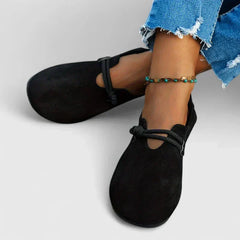 Mocassino elegante NORA nero in camoscio, laccetto incrociato e tomaia arrotondata
