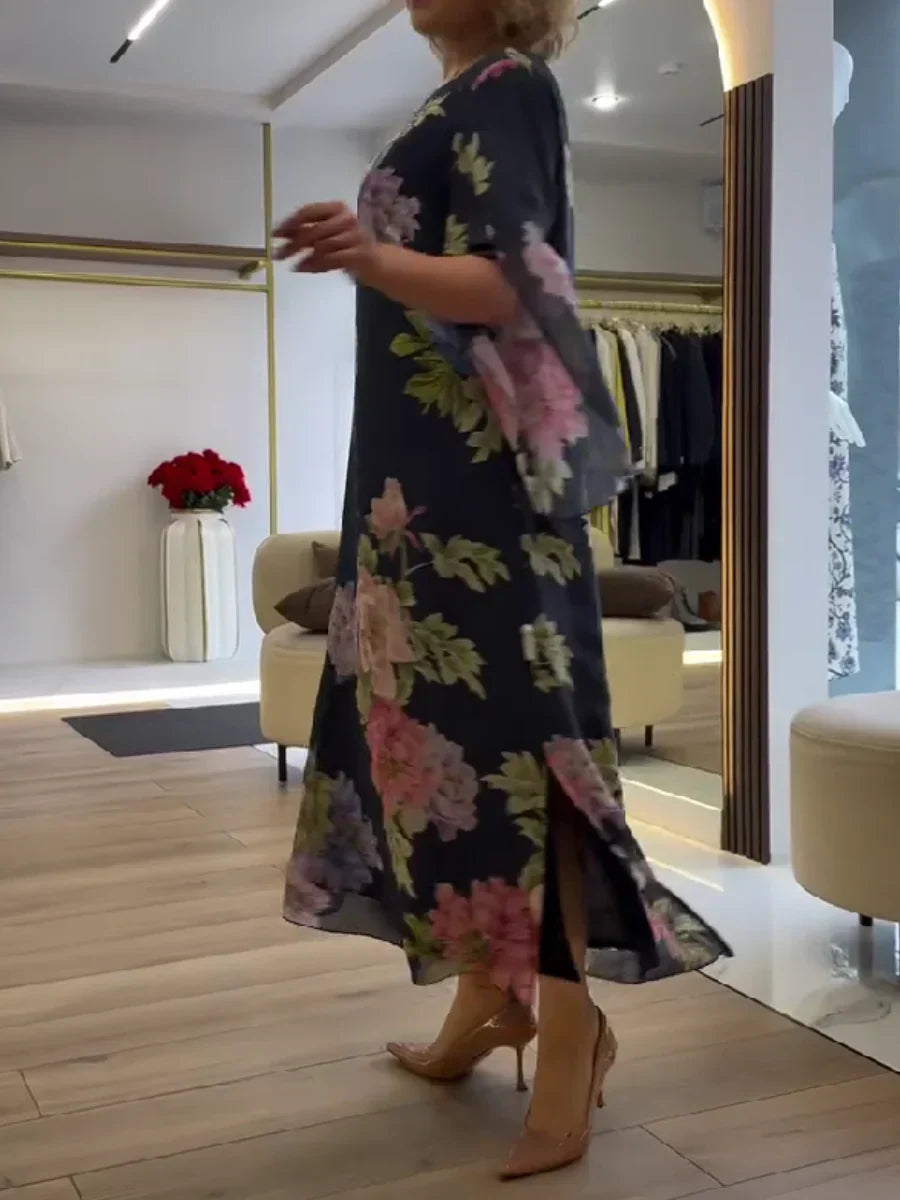 Abito maxi chiffon blu scuro con stampa floreale rosa e lilla, spacco laterale