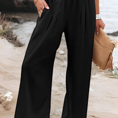 Black wide-leg trousers with shirred waistband and pleated front