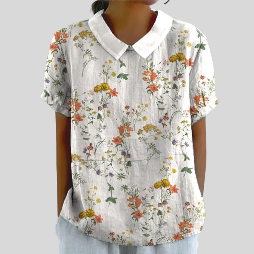 Top in lino bianco a maniche corte con colletto e stampa floreale multicolore